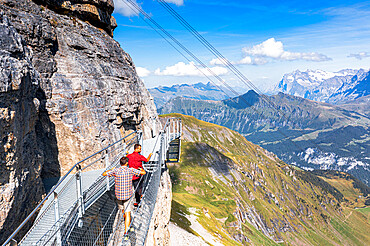 People on the Thrill Walk steel path built along a steep rock face, Murren Birg, Jungfrau Region, Bern Canton, Switzerland, Europe