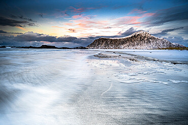 Sunset over frozen waves of the Arctic Sea, Skagsanden beach, Flakstad, Nordland county, Lofoten Islands, Norway, Scandinavia, Europe