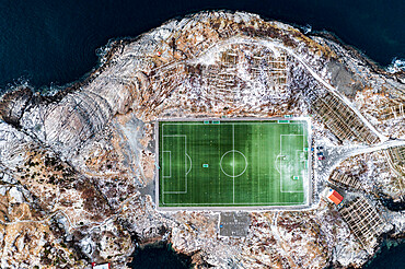 Football field on islet from above, aerial view, Henningsvaer, Nordland county, Lofoten Islands, Norway, Scandinavia, Europe