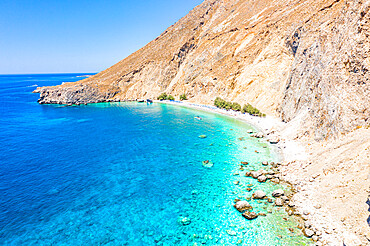 Aerial view of the scenic Glyka Nera beach by the crystal turquoise sea, Hora Sfakion, Crete island, Greek Islands, Greece, Europe