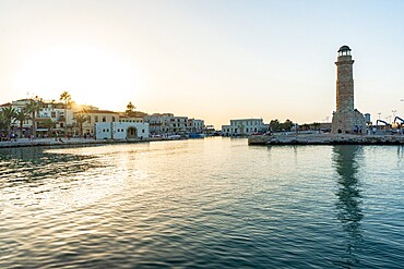 Sunset over the medieval town of Rethymno and old lighthouse, Crete island, Greek Islands, Greece, Europe