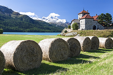 Haystacks lying on the bank of Lake Sils in Silvaplana, by Saint Moritz, Graubunden Switzerland, Europe