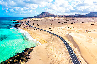 Aerial view of road crossing the desert overlooking the crystal sea, Corralejo Natural Park, Fuerteventura, Canary Islands, Spain, Atlantic, Europe