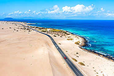 Cars traveling on road in between sand dunes and ocean, aerial view, Corralejo Natural Park, Fuerteventura, Canary Islands, Spain, Atlantic, Europe