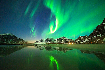 Bright night sky with Aurora Borealis (Northern Lights) over mountains and Skagsanden beach, Flakstad, Lofoten Islands, Norway, Scandinavia, Europe