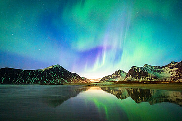 Bright night sky with Aurora Borealis (Northern Lights) over mountains and Skagsanden beach, Flakstad, Lofoten Islands, Norway, Scandinavia, Europe