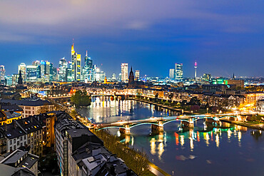 Lights of the Skyline of Frankfurt business district reflected in River Main at dusk, Frankfurt am Main, Hesse, Germany Europe