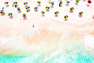 Aerial view of woman sunbathing on a tropical beach, Antigua, Caribbean, West Indies