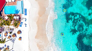 Aerial view of luxury resort with swimming pool on a tropical beach, Antigua, Leeward Islands, Caribbean, West Indies