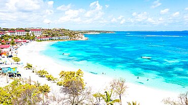 Aerial view of luxury resort on white sand beach washed by the turquoise Caribbean Sea, Long Bay, Antigua, West Indies