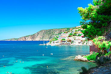 Small village and harbor of Assos overlooking the turquoise blue sea, Kefalonia, Ionian Islands, Greek Islands, Greece, Europe