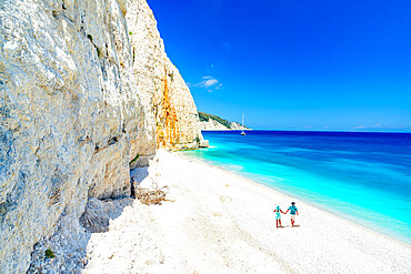 Man and woman holding hands on the idyllic Fteri Beach, overhead view, Kefalonia, Ionian Islands, Greek Islands, Greece, Europe