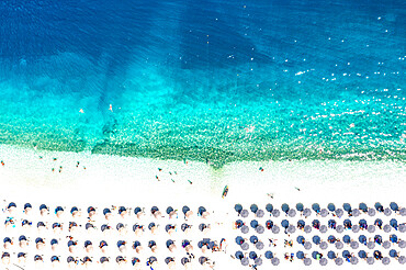 Aerial view of sunshades on idyllic beach washed by waves, Kefalonia, Ionian Islands, Greek Islands, Greece, Europe