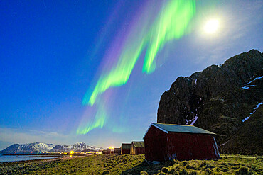 Moonlight over the fishing village of Eggum under the Aurora Borealis (Northern Lights), Vestvagoy, Nordland county, Lofoten Islands, Norway, Scandinavia, Europe