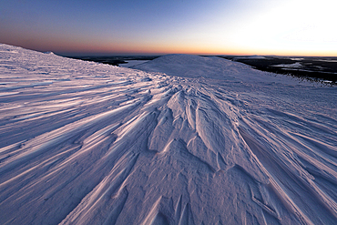 Ice sheets covering the snowy mountains at dusk, Pallas-Yllastunturi National Park, Muonio, Lapland, Finland, Europe