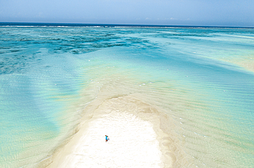 Aerial view of woman walking on sandbank at low tide, Nungwi, Zanzibar, Tanzania, East Africa, Africa