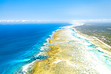 Waves crashing on sandbanks nearby an idyllic blue lagoon, aerial view, Pingwe, Michamvi, Zanzibar, Tanzania, East Africa, Africa