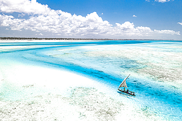 Overhead view of tourist boat on coral reef in the exotic lagoon, Paje, Jambiani, Zanzibar, Tanzania, East Africa, Africa