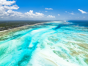 Aerial view of white coral sand of a blue lagoon at low tide, Paje, Jambiani, Zanzibar, Tanzania, East Africa, Africa