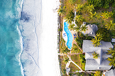 Luxury resort with swimming pool on a palm fringed beach, aerial view, Zanzibar, Tanzania, East Africa, Africa