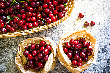 Red organic cherries in baskets ready to eat from above, Italy, Europe