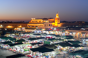 Dusk lights over the iconic markets in Jemaa el Fna square, UNESCO World Heritage Site, Marrakech, Morocco, North Africa, Africa