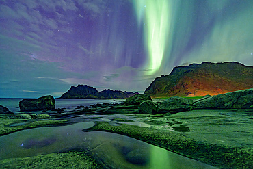 Uttakleiv beach under the multicolored sky during the Aurora Borealis (Northern Lights), Vestvagoy, Lofoten Islands, Nordland, Norway, Scandinavia, Europe