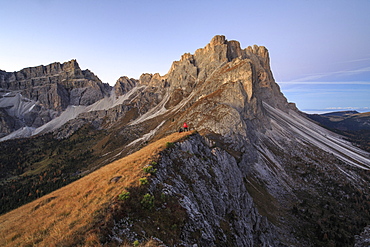 Hiker admires the rocky peaks Furcella De Furcia, Odle, Funes Valley, South Tyrol, Dolomites, Trentino-Alto Adige, Italy, Europe