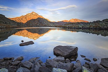 Peak Tambo reflected in Lake Bergsee at dawn, Chiavenna Valley, Spluga Valley, Switzerland, Europe