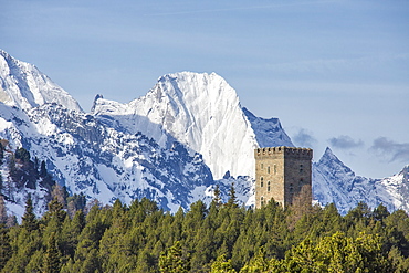 The Belvedere Tower frames the snowy peaks and Peak Badile on a spring day, Maloja Pass, Canton of Graubunden, Switzerland, Europe