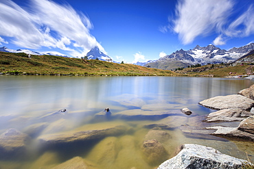 Lake Leisee frames the Matterhorn and the high peaks in the background in summer, Zermatt, Canton of Valais, Swiss Alps, Switzerland, Europe