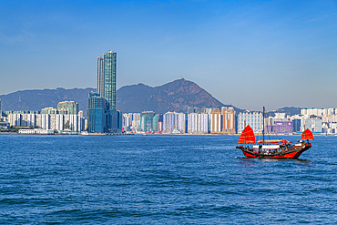 Traditional sailing boat in front of high rise buildings in Central Hongkong, China, Asia