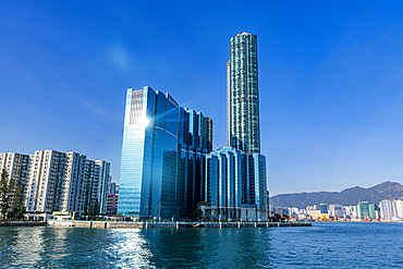 Highrise buildings in Victoria harbour at sunset, Hong Kong, China, Asia