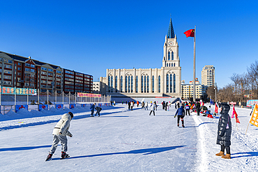 Skating rink in front of the old Cathedral, Heihe, Heilongjiang, China, Asia