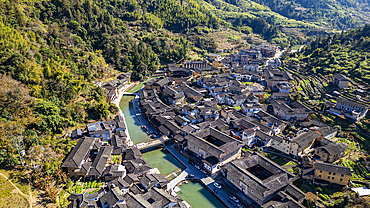 Aerial of Taxia village and Fujian Tulou, rural dwelling of the Hakka, Fujian, China, Asia