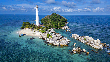 Aerial of Old Indie Lighthouse, Lengkuas Island, Belitung island off the coast of Sumatra, Indonesia, Southeast Asia, Asia