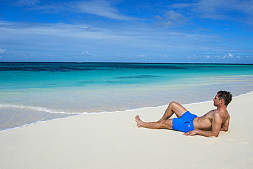 Man relaxing on the world class Shoal Bay East beach, Anguilla, British Oversea territory, West Indies, Caribbean, Central America