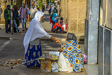 Woman buying from a street vendor, Asmara, Eritrea, Africa