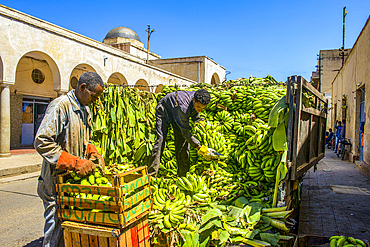 Men carrying bananas from a truck, Asmara, Eritrea, Africa