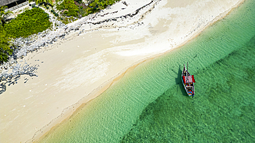 Aerial of a traditional Dhow on a white sand beach, Goa island near the Island of Mozambique, Mozambique, Africa