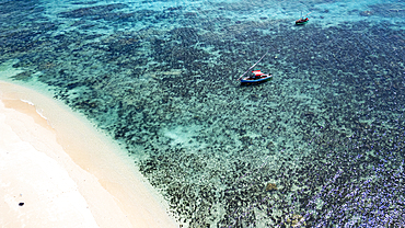 Aerial of a traditional Dhow on a white sand beach, Goa island near the Island of Mozambique, Mozambique, Africa