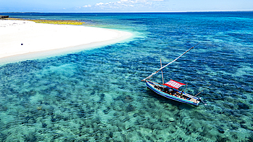 Aerial of a traditional Dhow on a white sand beach, Goa island near the Island of Mozambique, Mozambique, Africa