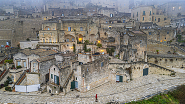 Aerial of Sassi di Matera in fog, UNESCO World Heritage Site, Basilicata, Italy, Europe