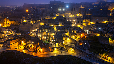 Aerial of Sassi di Matera at night, UNESCO World Heritage Site, Basilicata, Italy, Europe