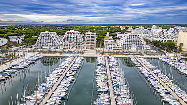 Aerial of the sport harbour, futuristic seaside town of La Grande Motte, Herault, Occitania, France, Europe