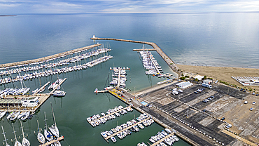 Aerial of the sport harbour, futuristic seaside town of La Grande Motte, Herault, Occitania, France, Europe