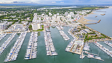 Aerial of the sport harbour, futuristic seaside town of La Grande Motte, Herault, Occitania, France, Europe