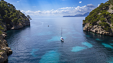 Aerial of a little sailingboat in a bay on the Formentor Peninsula, Mallorca, Balearic islands, Spain, Mediterranean, Europe