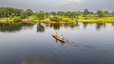 Aerial of a dugout canoe on the Congo River, Mbandaka, Equateur province, Democratic Republic of Congo, Africa