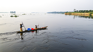 Aerial of a dugout canoe on the Congo River, Mbandaka, Equateur province, Democratic Republic of Congo, Africa